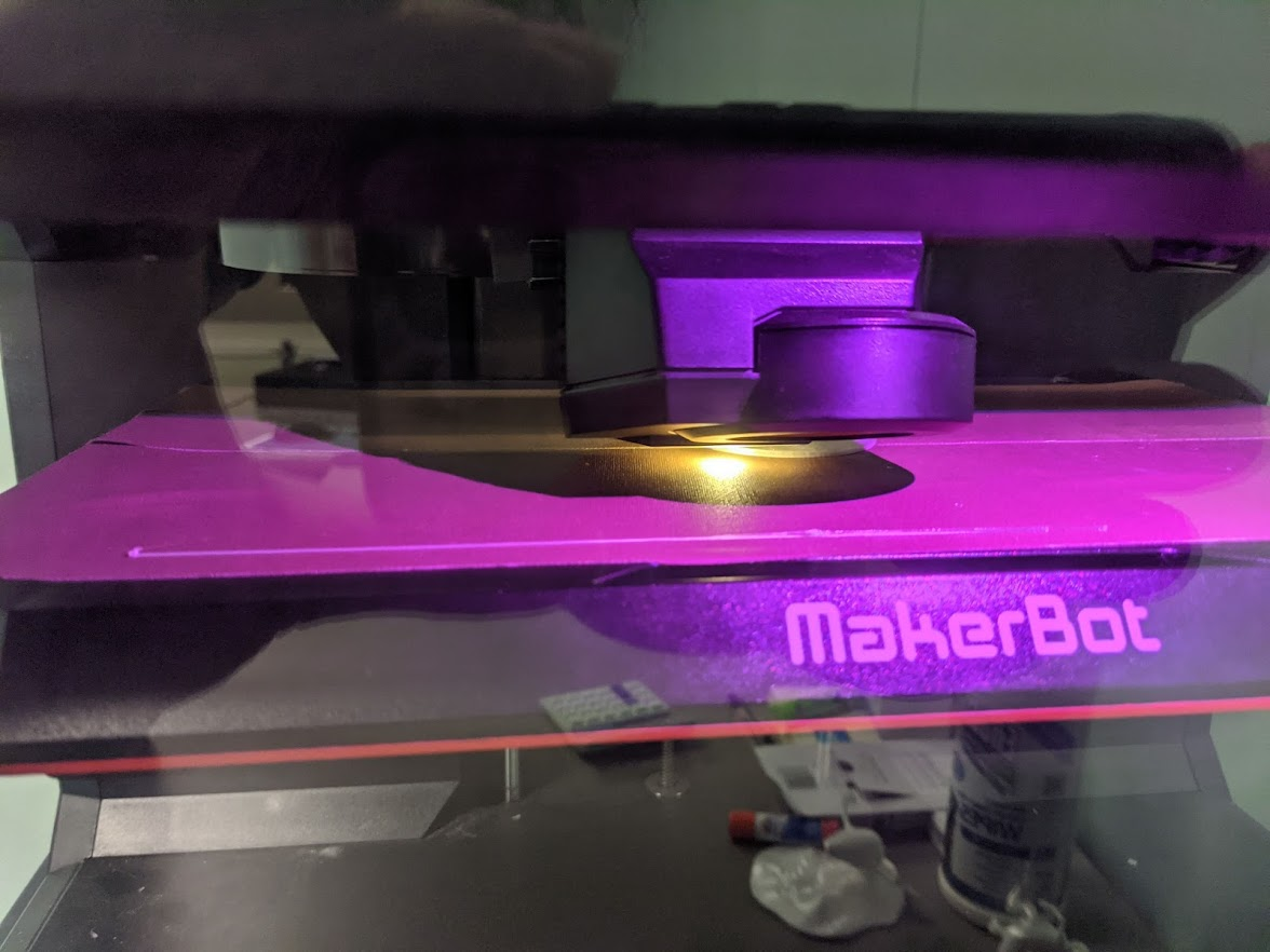 A MakerBot Replicator+ printing a test strand of filament