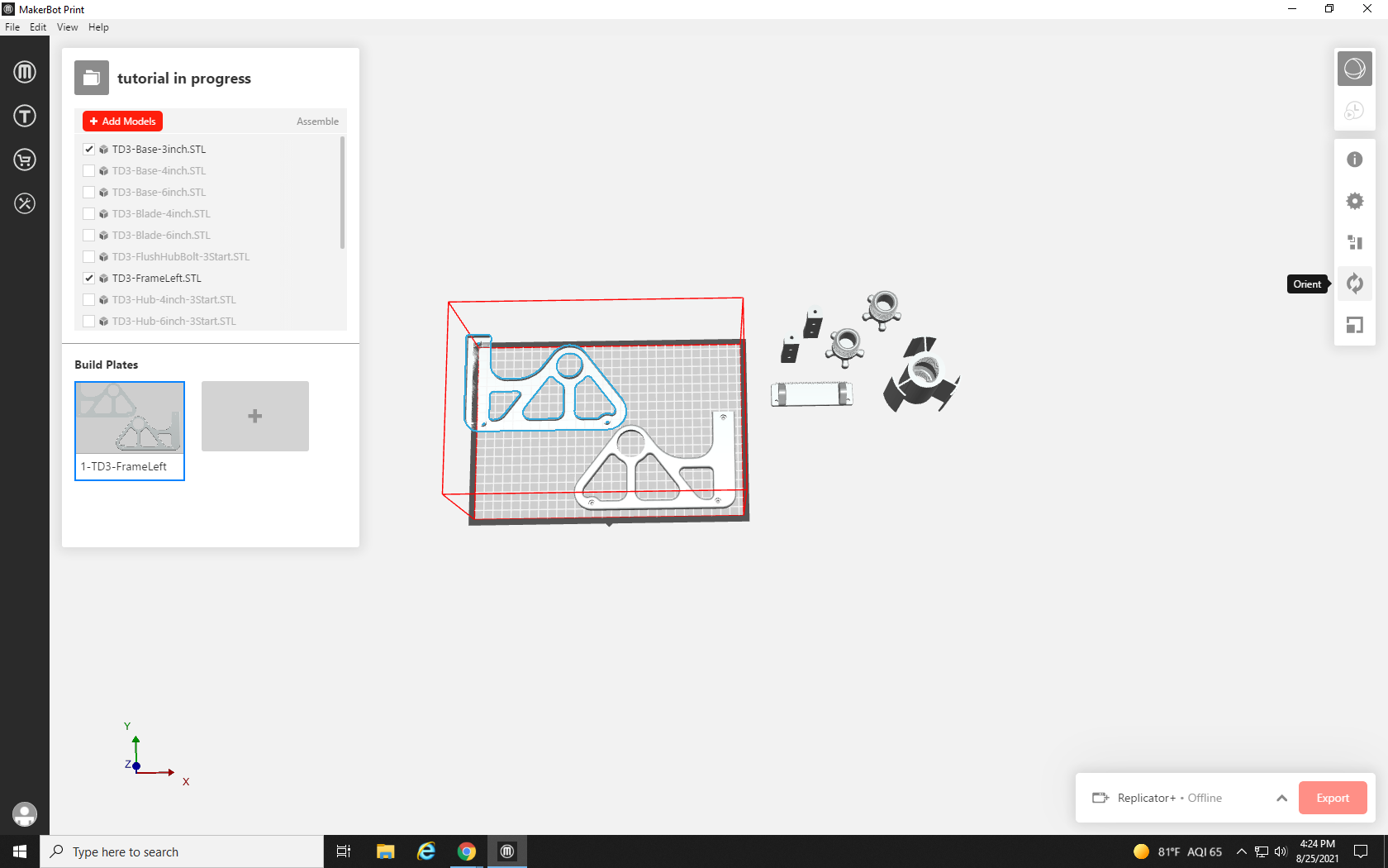 Screenshot of build plate with second large side frame part for the tape dispenser print not fully fitting on it. On the right-hand toolbar, the Orient Tool, which looks like a circle made out of arrows, is highlighted.