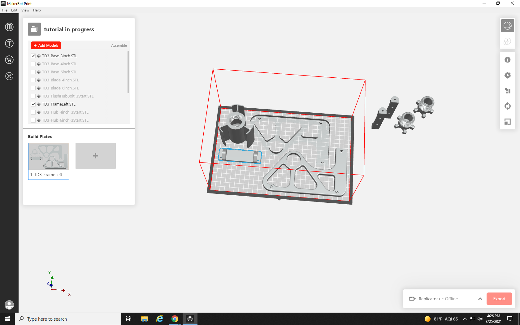 Screenshot of build plate with four parts on it, the two large side parts for the tape dispenser, a roller, and a tape cutter part.