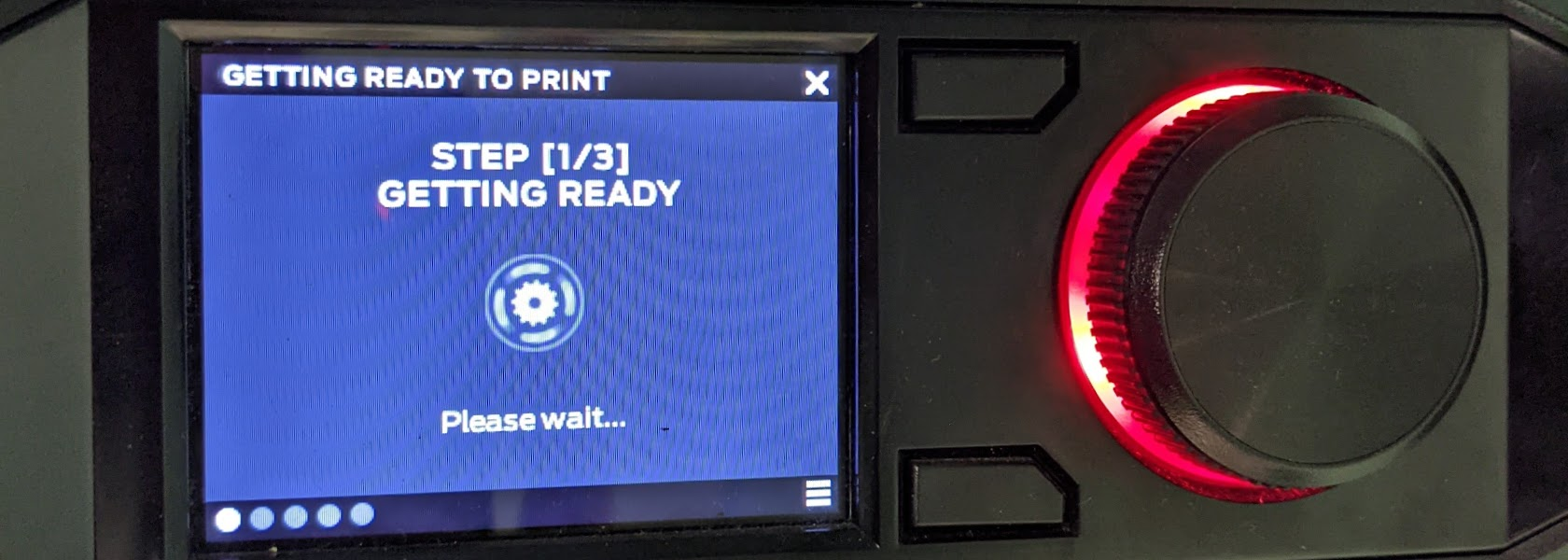 Close up of the MakerBot Replicator+ screen showing Step 1 of the printing process